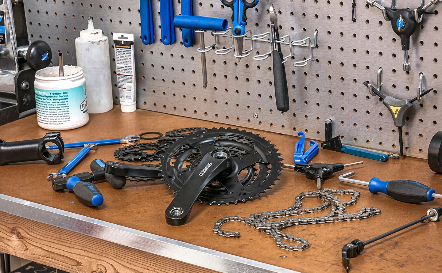 bike servicing bench with bike gear, chain, and bike tools